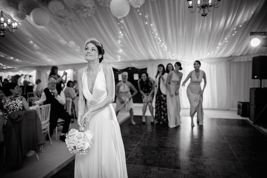 Bride throws bouquet wedding