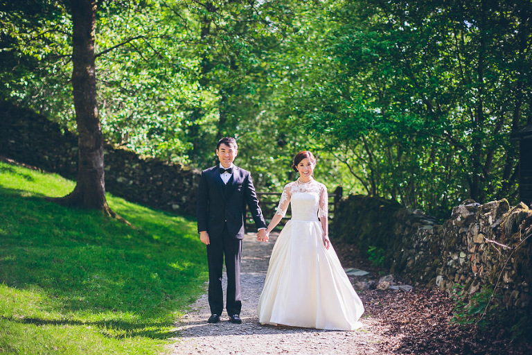 bride and groom holding hands