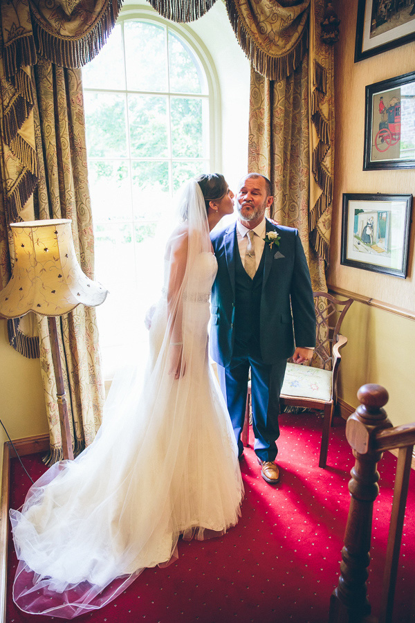 bride kisses her father