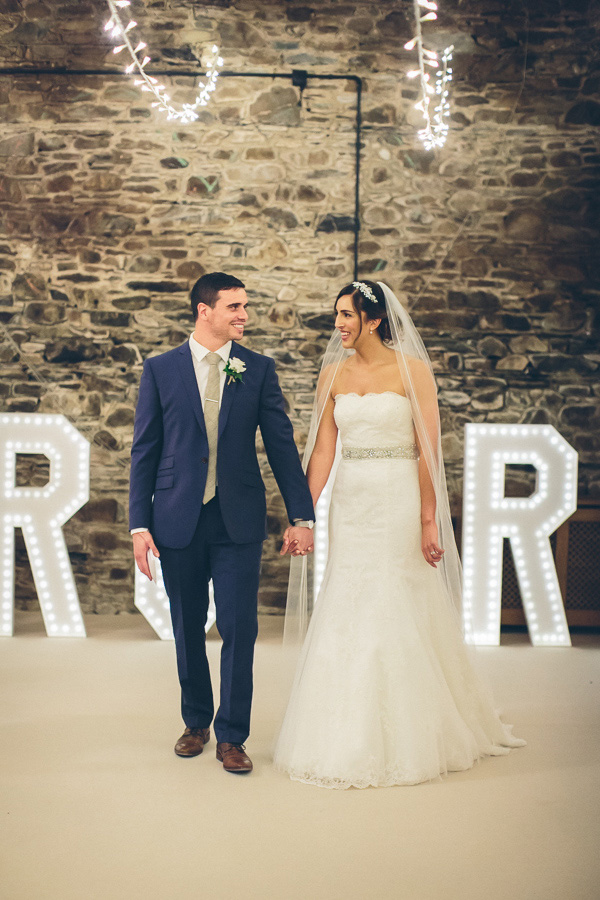 bride and groom smile