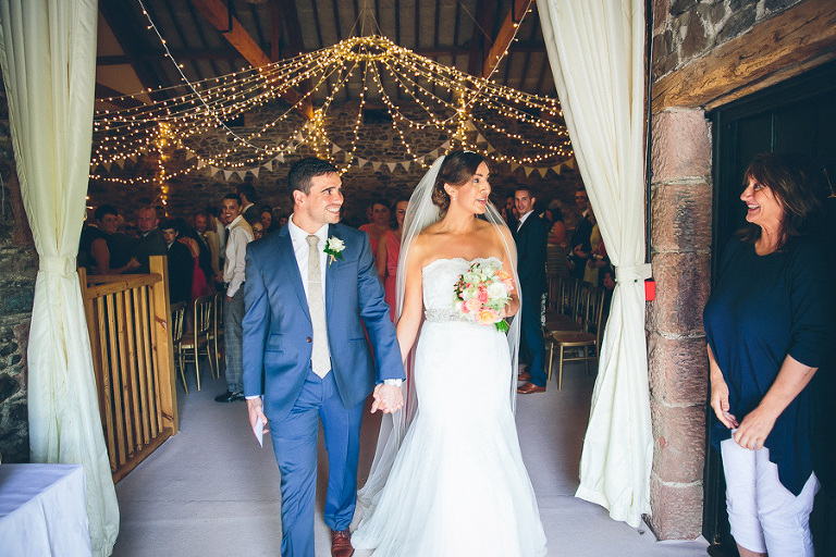 bride and groom walk back down the aisle
