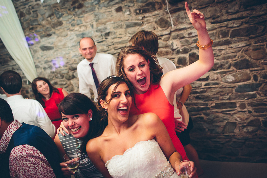 bride dancing with girlfriend