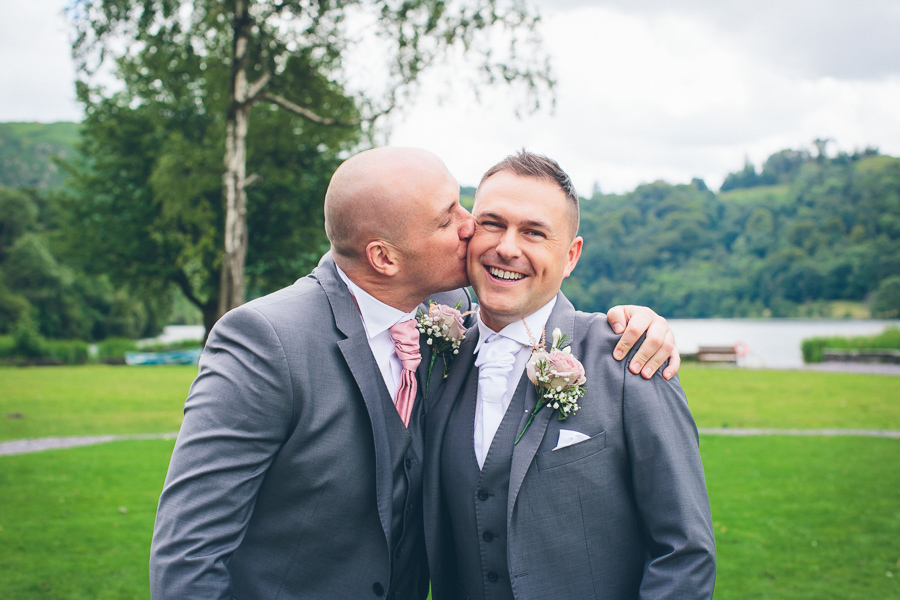 best man kissing groom