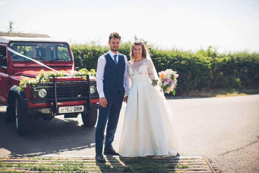 bride and groom three hills barn